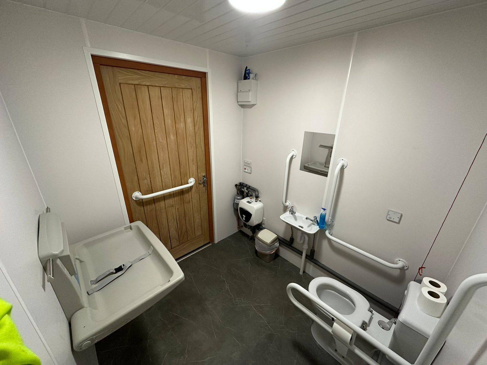 Accessible bathroom renovation with grab rails