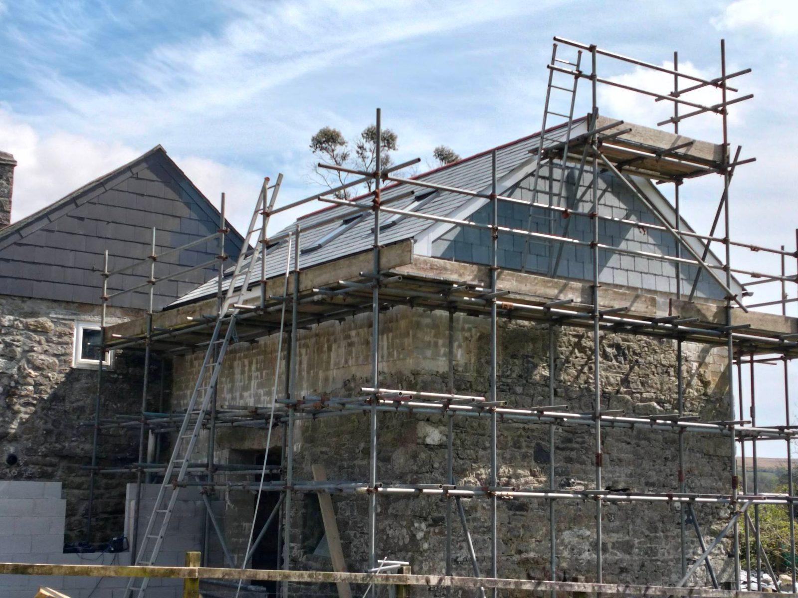 Stone property mid-renovation with new roof by Clifford Building Contractors