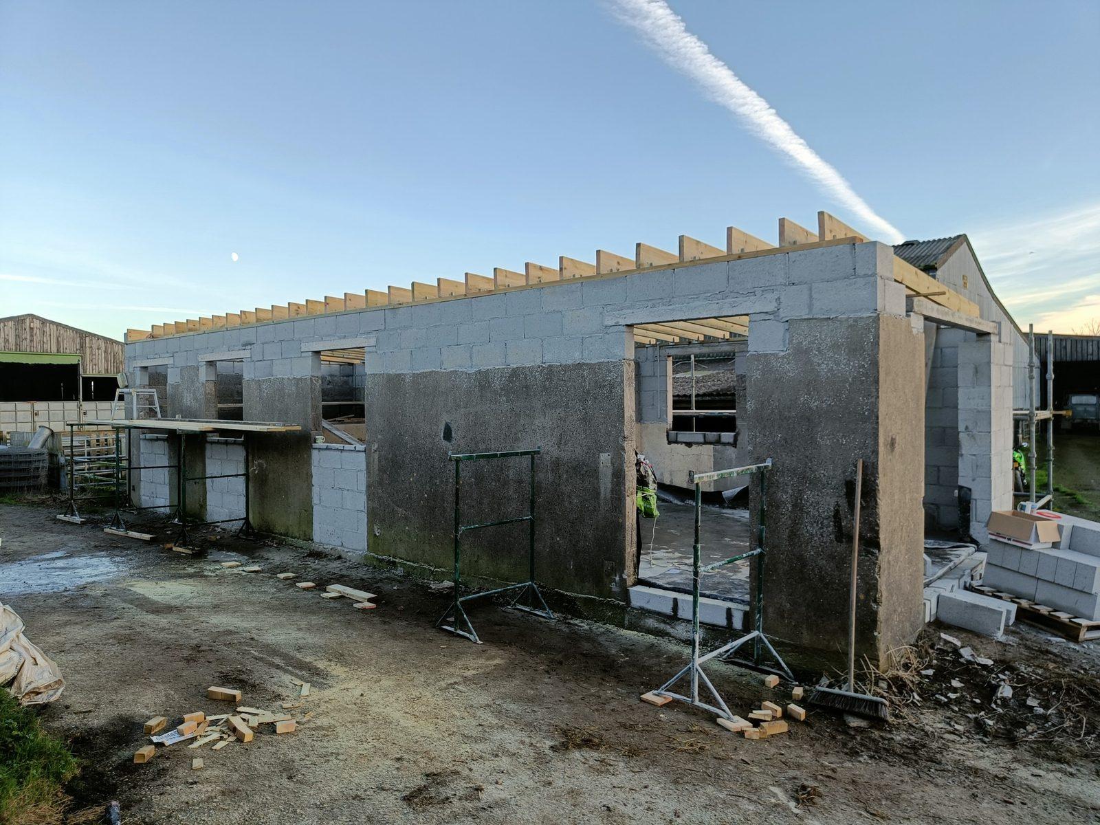 New build house with blockwork walls and timber roof rafters