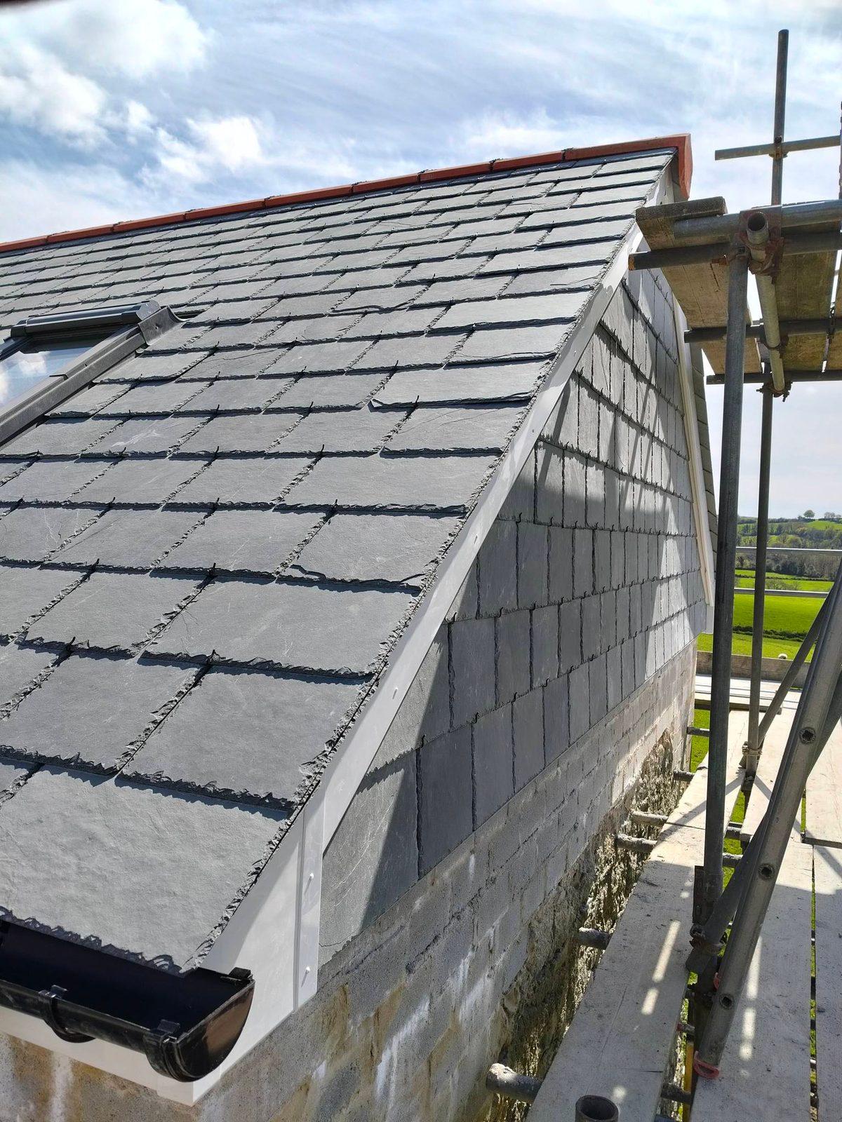 Finished slate roof gable with new lead and guttering