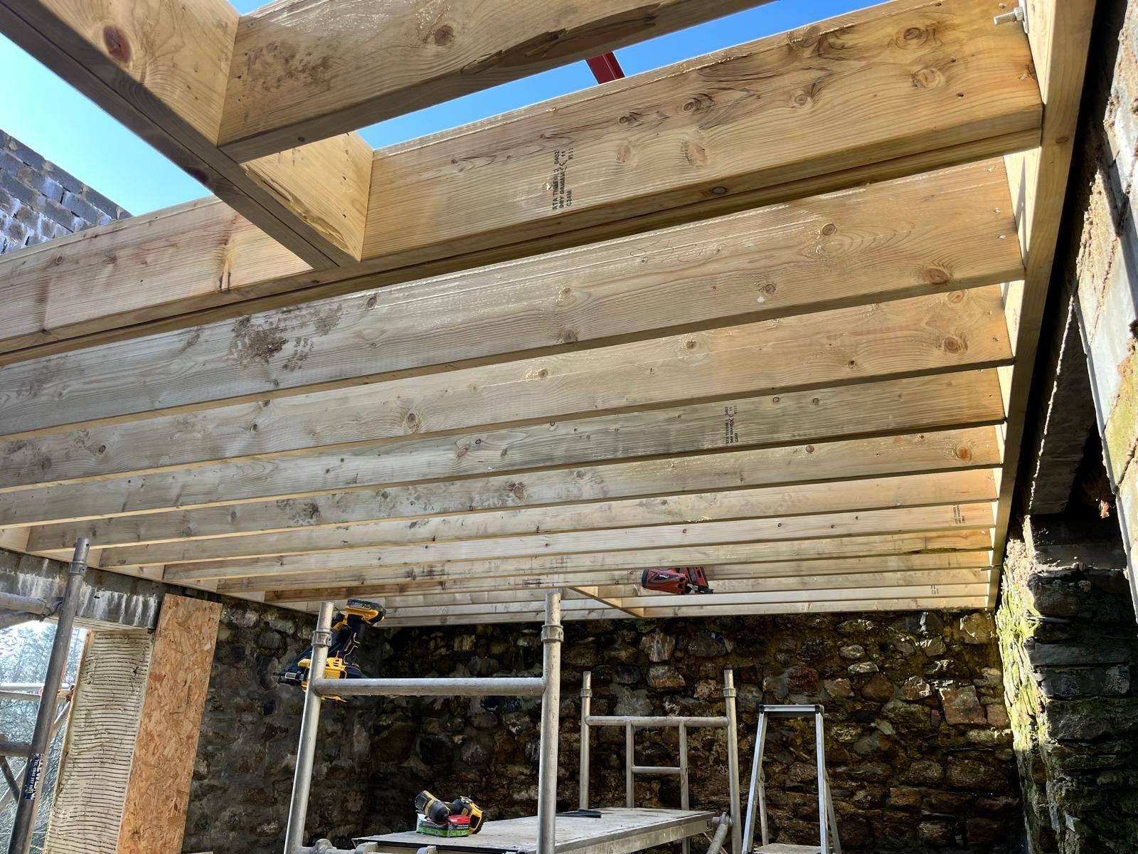 Load-bearing wall removal with new structural timbers